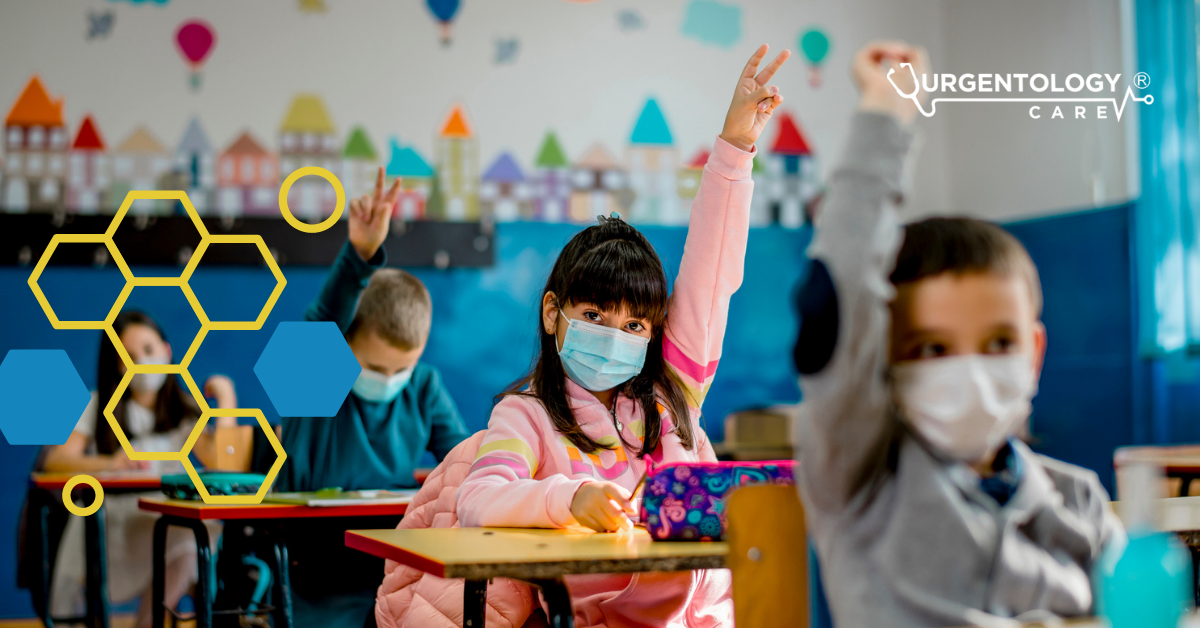 girl in mask in school raising hand